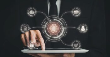 Fingerprints-centered biometric security on a tablet with connected icons for cloud, card, documents, lock, money, and shopping cart indicating authentication.